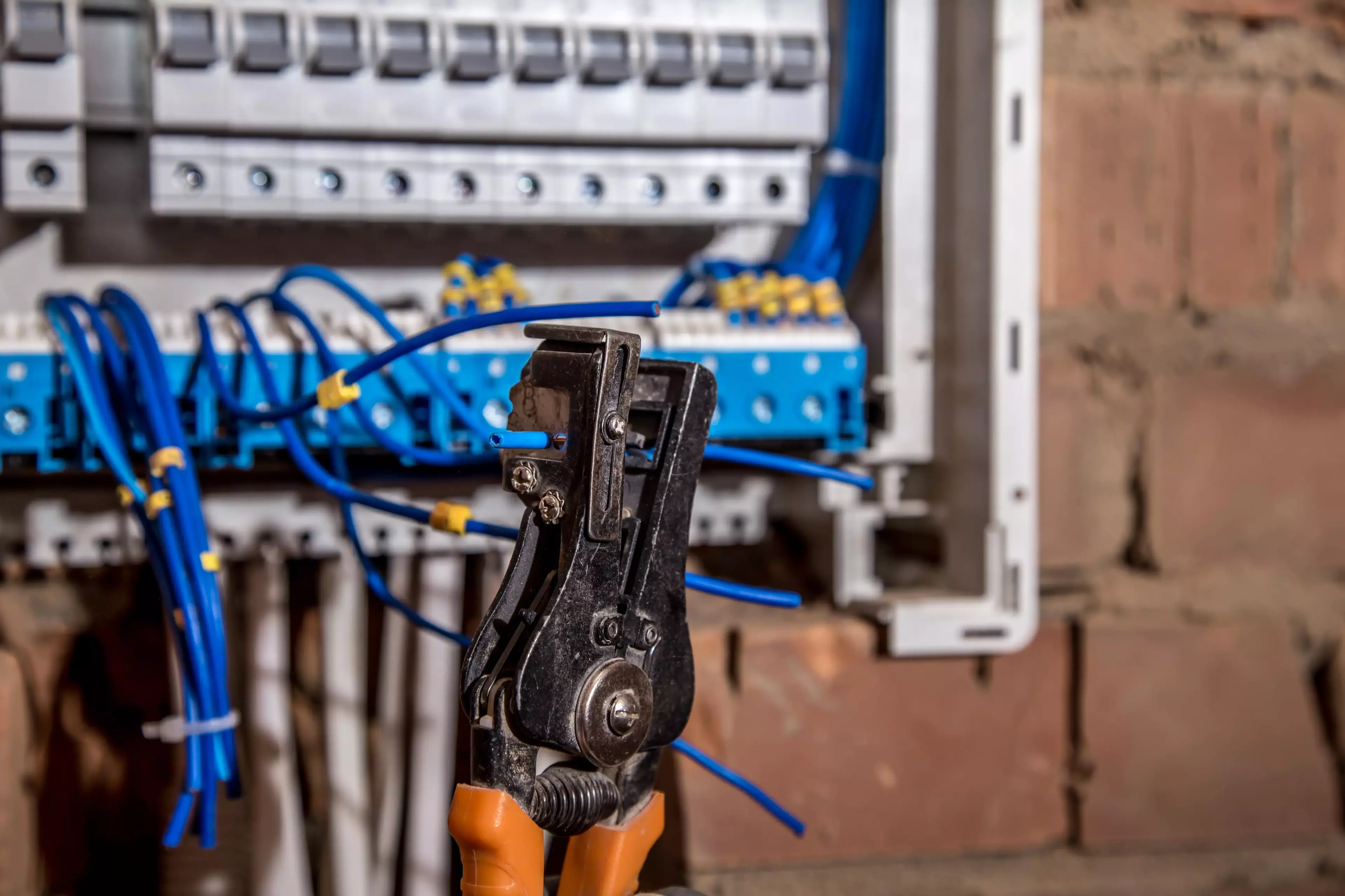 Construction worker working on electrical wirebox