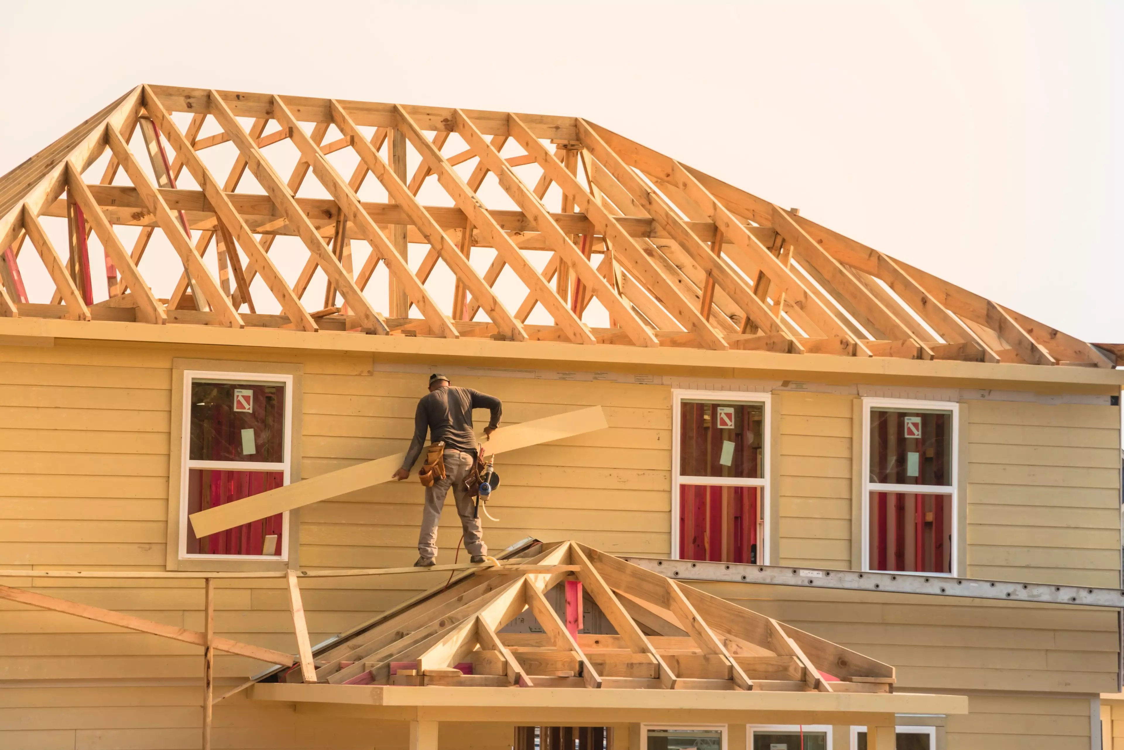 Workers on a house construction site.