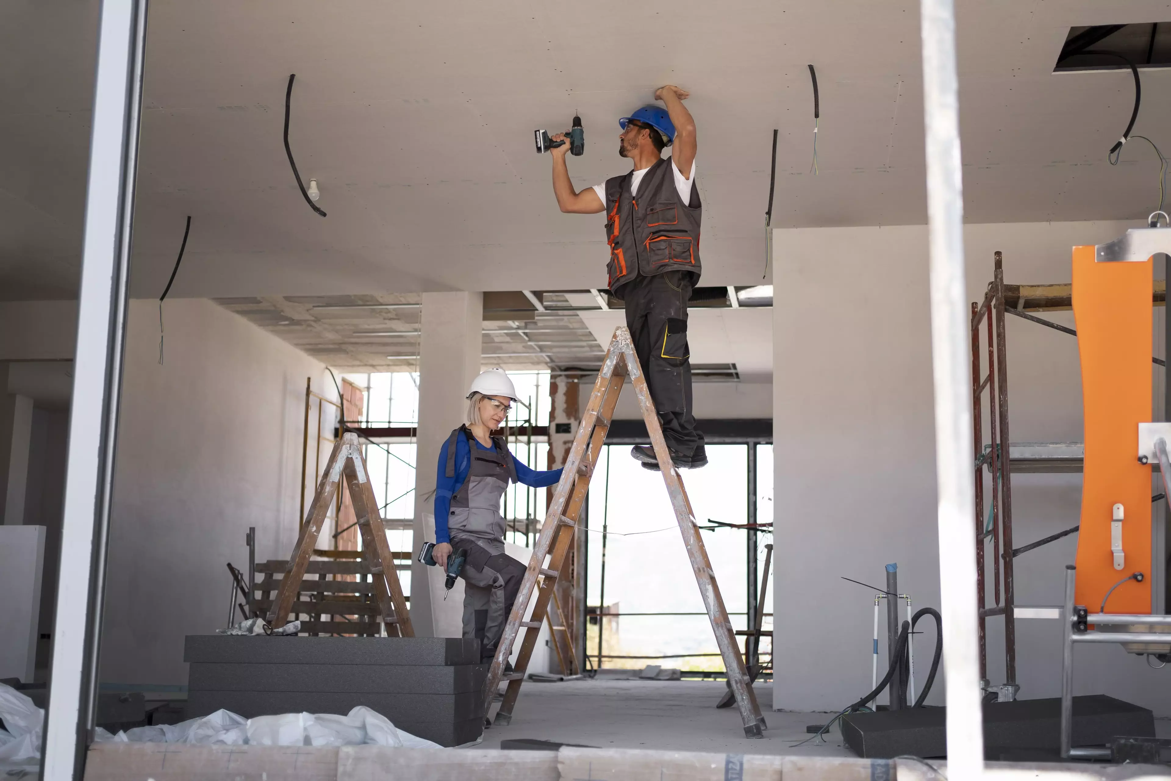 Workers working on remodeling a building.